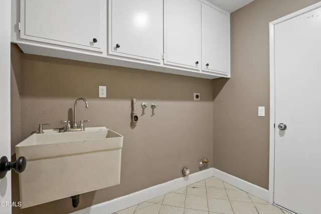 a bathroom with a sink and cabinets