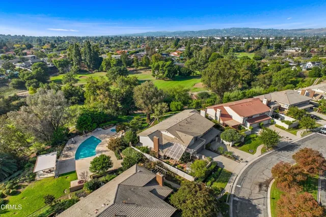 an aerial view of a house with a garden