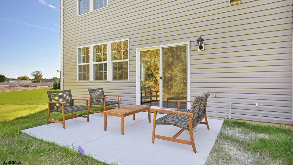 501 Scotty Boulevard, Unit 1304 Rio Grande, NJ 08242 - Photo 42 of 46 a view of a house with backyard and sitting area