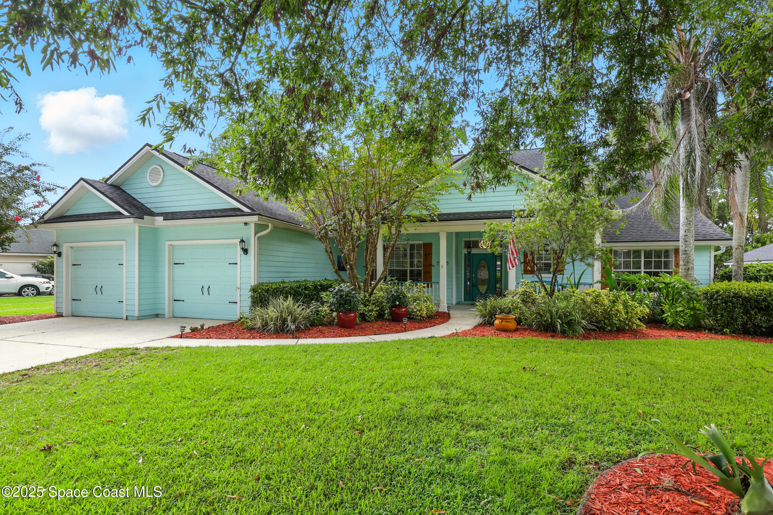 2560 Benjamin Road Jacksonville, FL 32223 - Photo 1 of 48 a front view of a house with a garden and yard