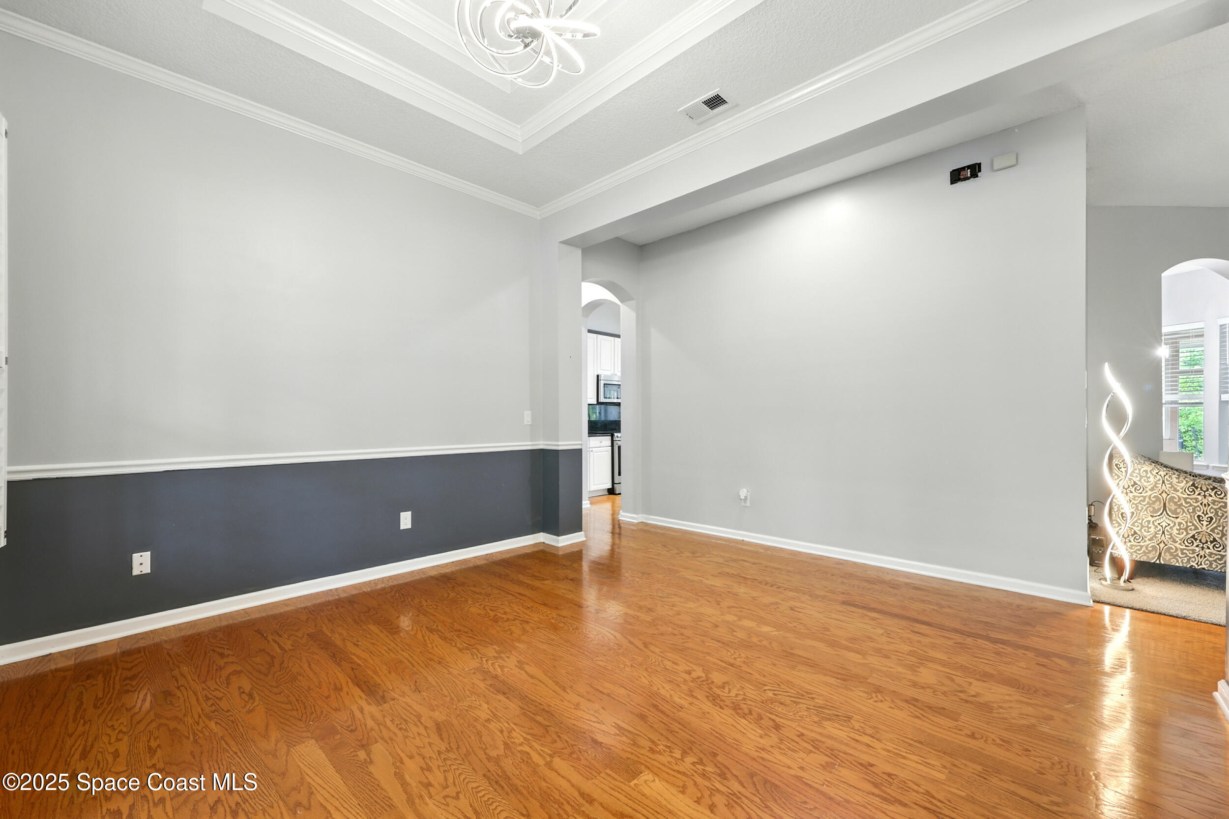 2560 Benjamin Road Jacksonville, FL 32223 - Photo 15 of 48 an empty room with wooden floor and windows