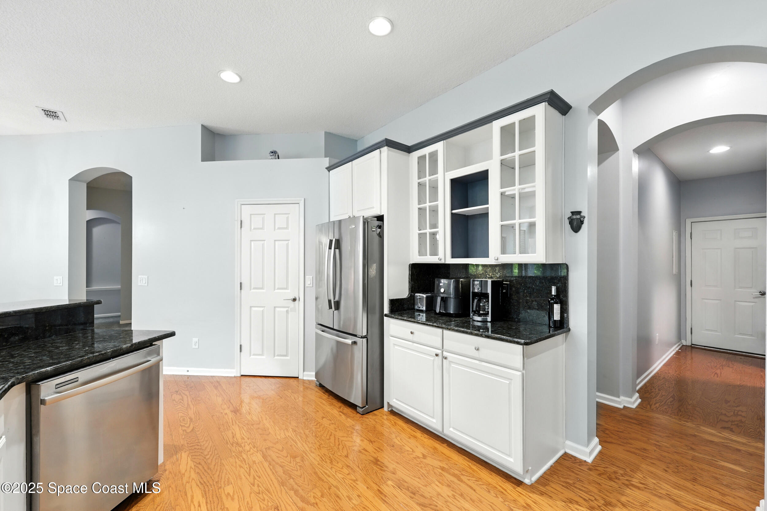 2560 Benjamin Road Jacksonville, FL 32223 - Photo 20 of 48 a kitchen with stainless steel appliances a refrigerator stove and sink