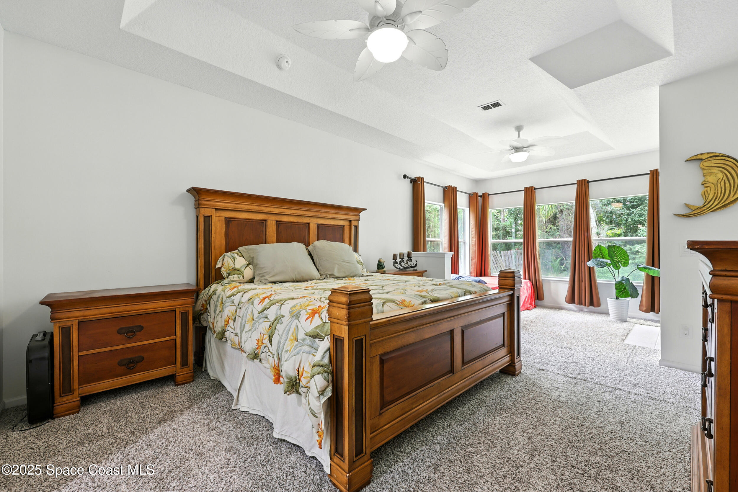 2560 Benjamin Road Jacksonville, FL 32223 - Photo 21 of 48 a bed sitting in a spacious bedroom next to a window