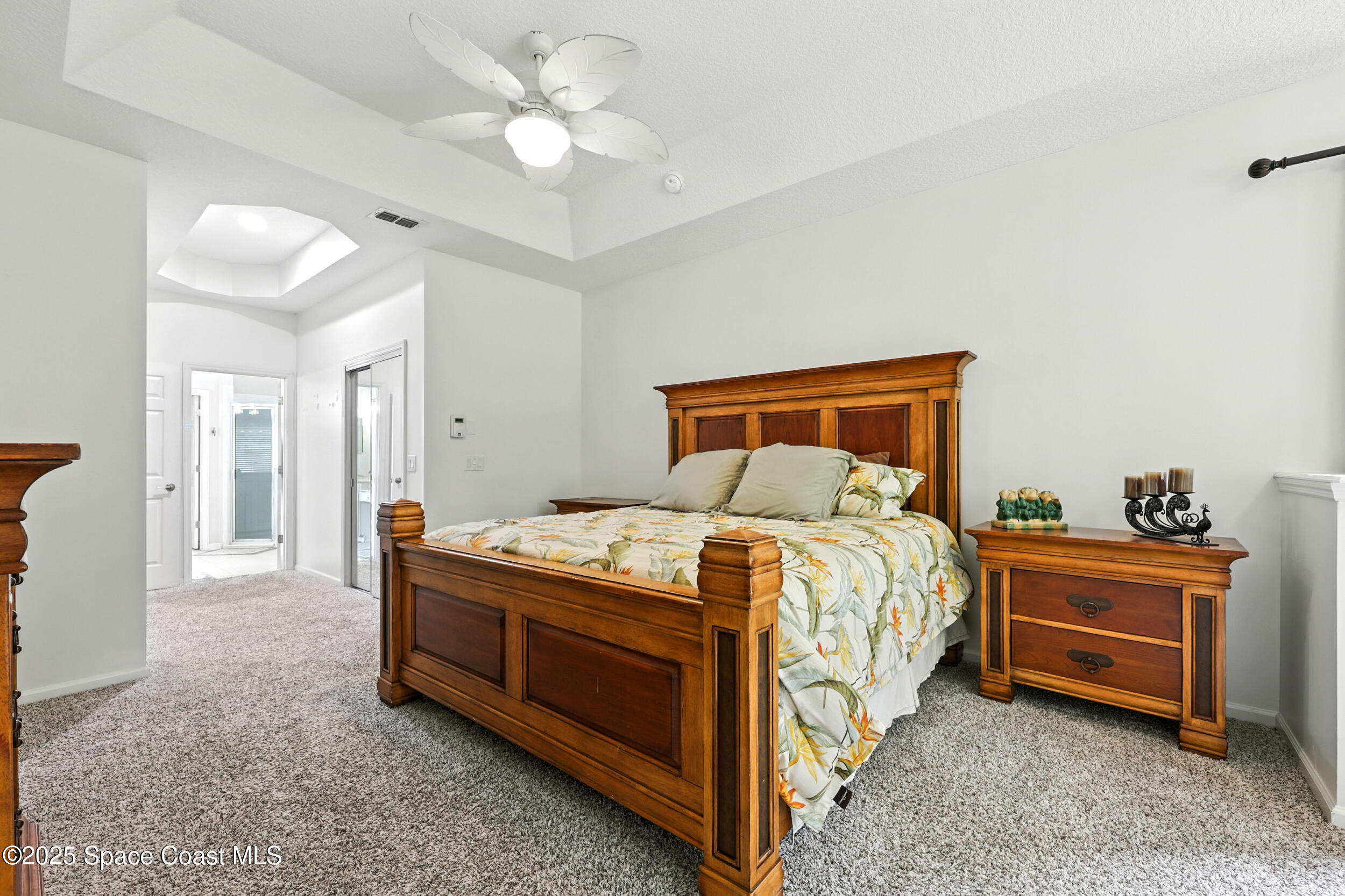 2560 Benjamin Road Jacksonville, FL 32223 - Photo 22 of 48 a bedroom with a bed and a chandelier