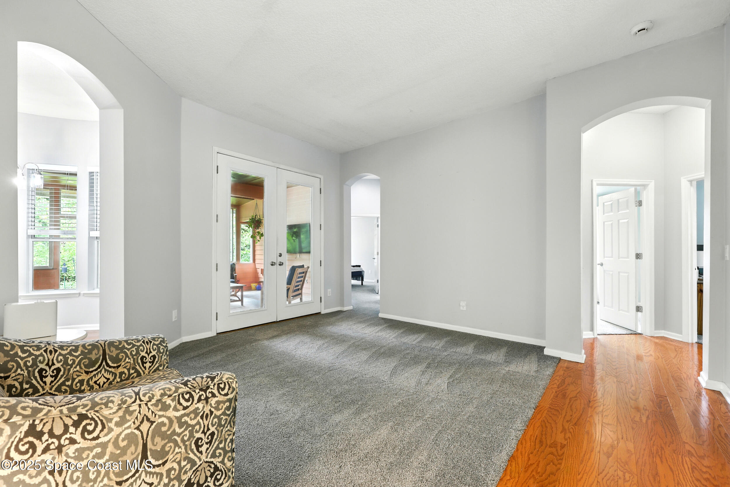 2560 Benjamin Road Jacksonville, FL 32223 - Photo 28 of 48 an empty room with window and wooden floor