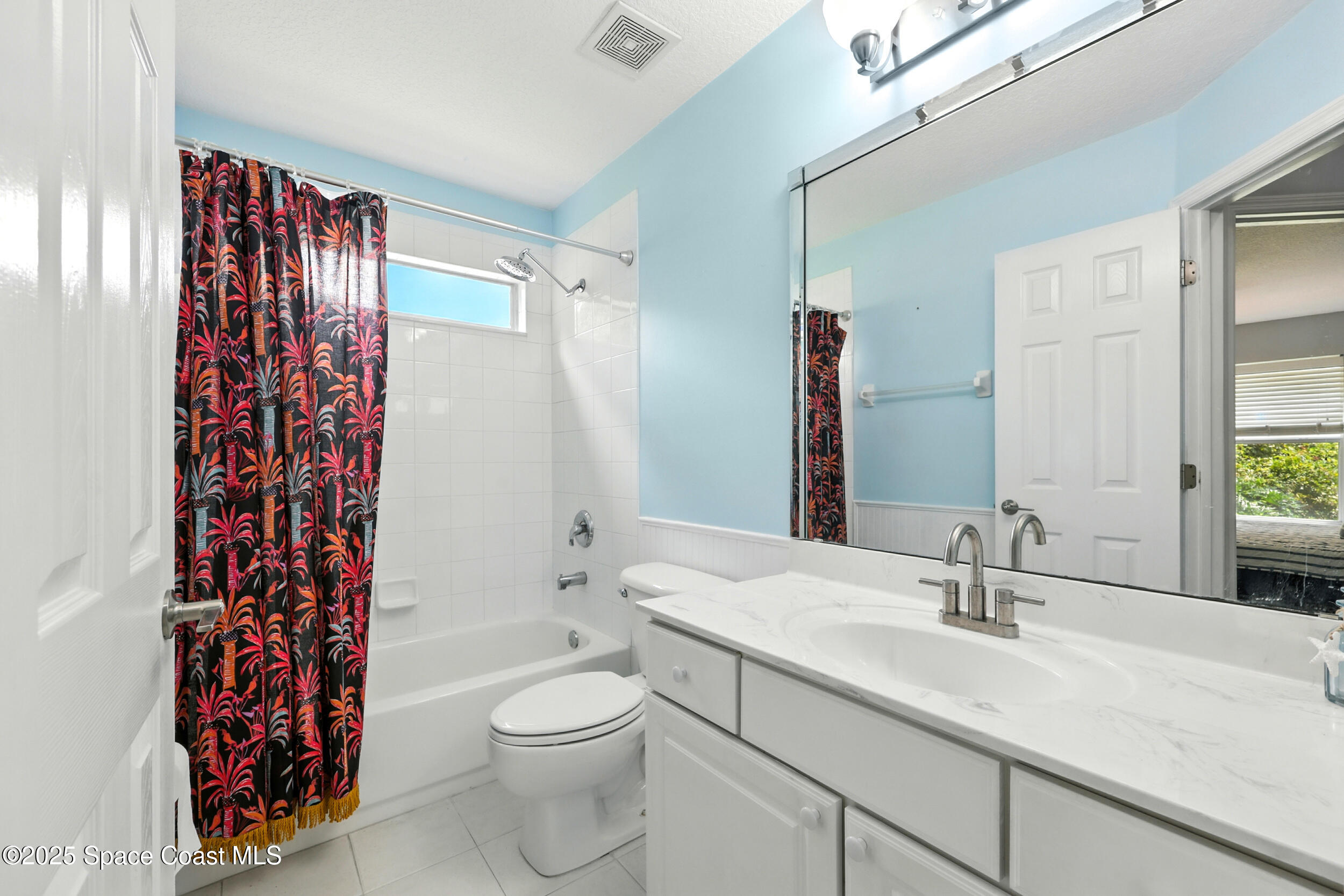 2560 Benjamin Road Jacksonville, FL 32223 - Photo 34 of 48 a bathroom with a sink a toilet and shower curtain