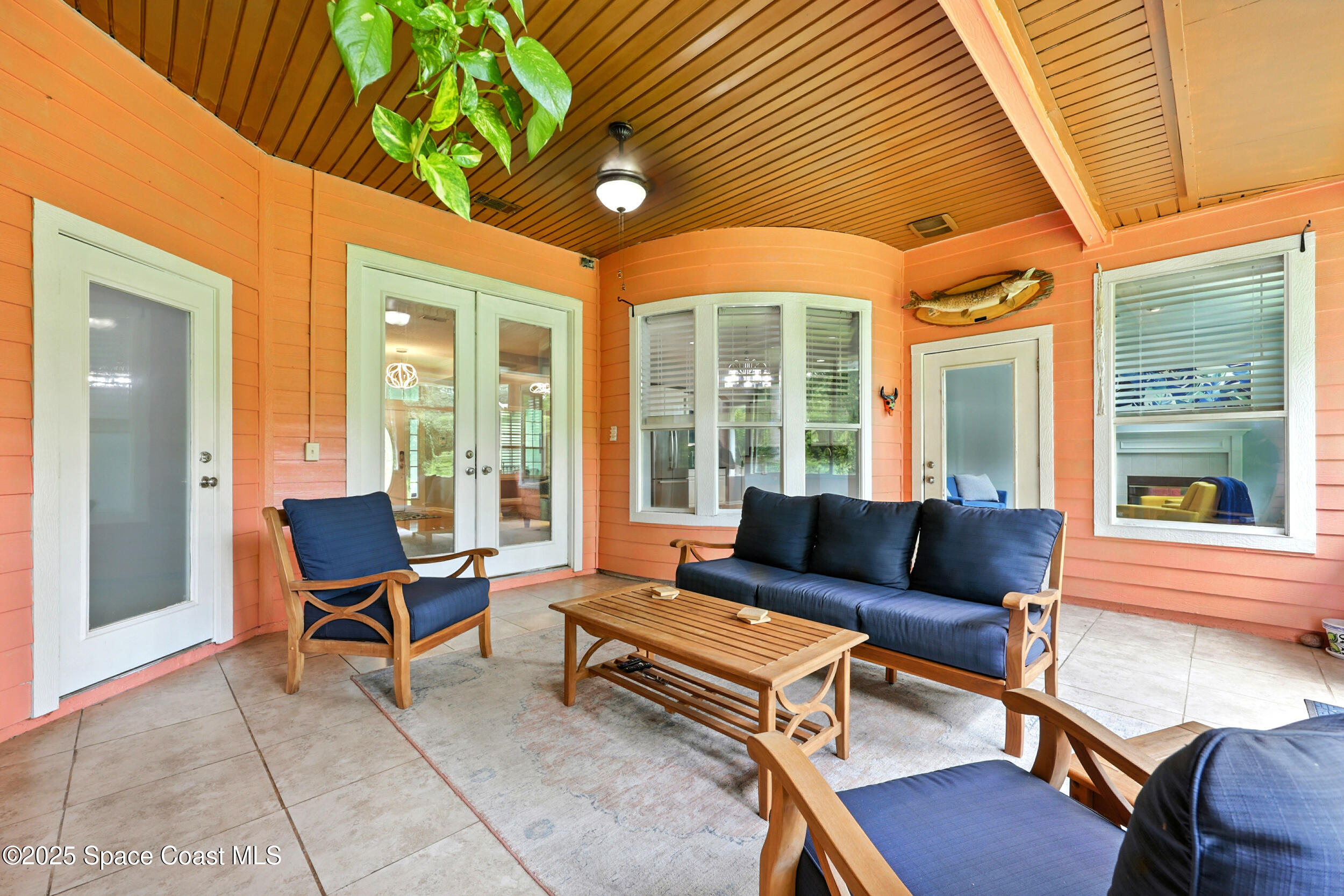 2560 Benjamin Road Jacksonville, FL 32223 - Photo 40 of 48 a outdoor living space with furniture and a ceiling fan