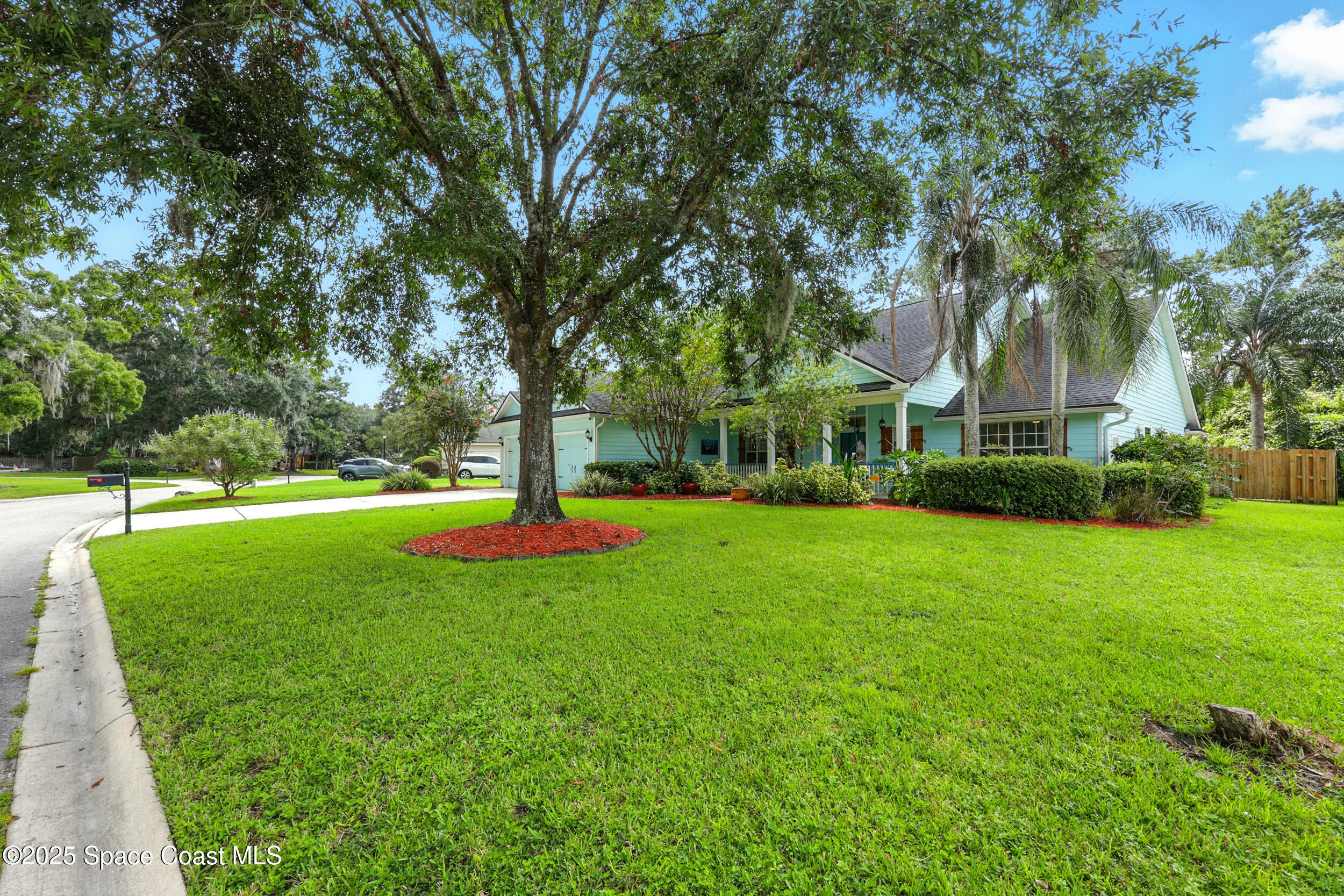 2560 Benjamin Road Jacksonville, FL 32223 - Photo 44 of 48 a view of a house with a big yard and large trees