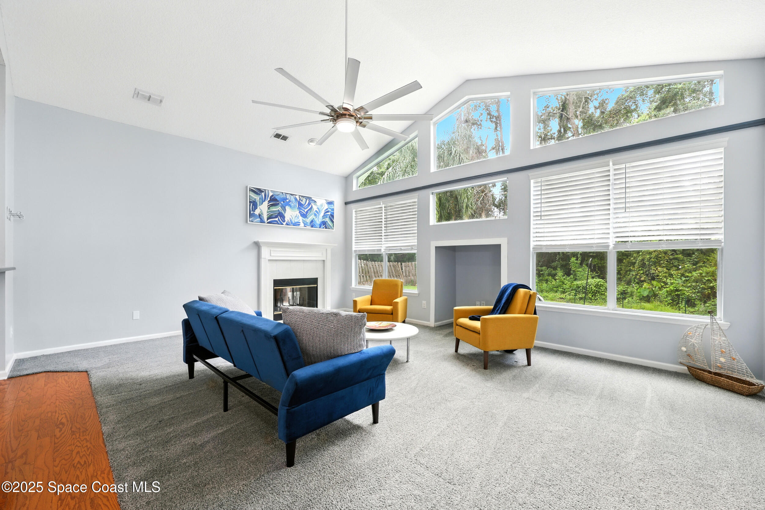 2560 Benjamin Road Jacksonville, FL 32223 - Photo 7 of 48 a living room with furniture a large window and a fireplace