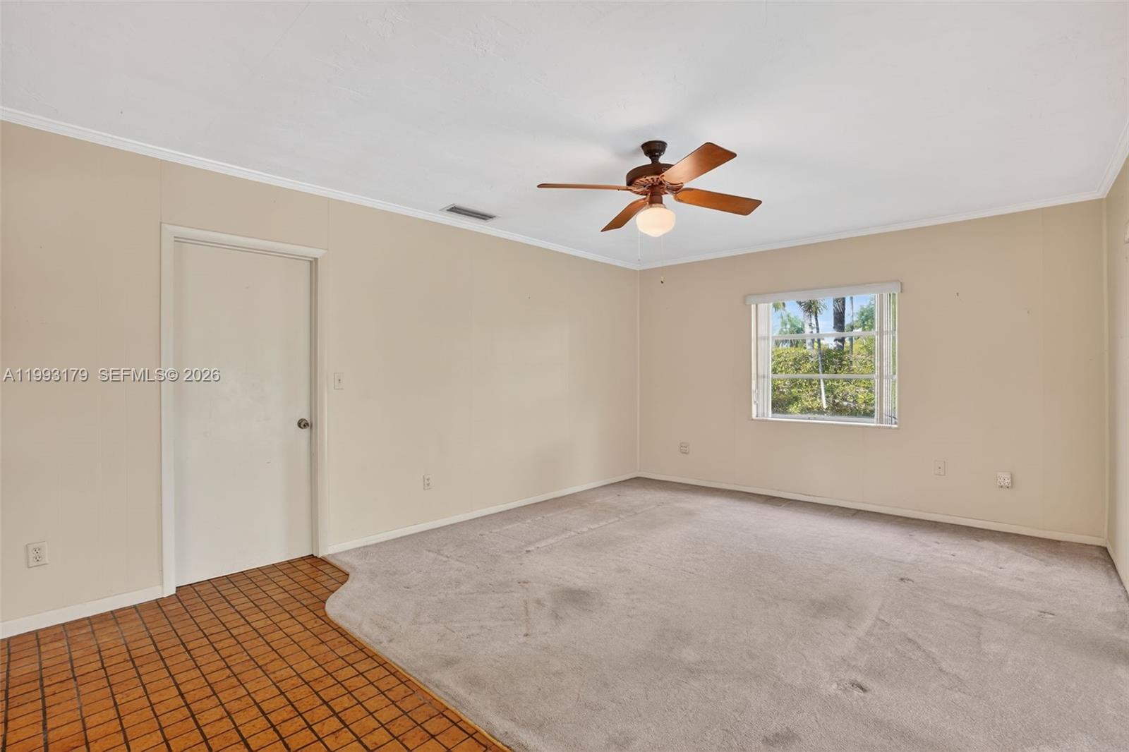 10753 Southwest 118th Street Miami, FL 33176 - Photo 15 of 51 wooden floor in an empty room with a window