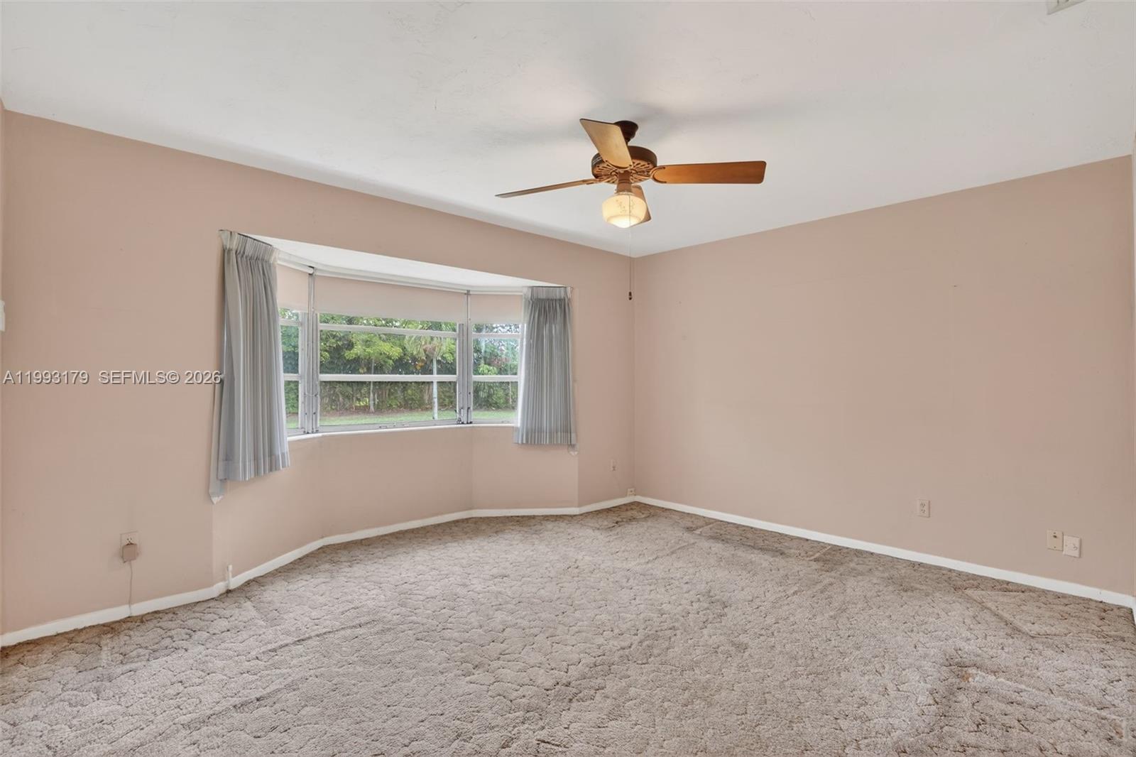 10753 Southwest 118th Street Miami, FL 33176 - Photo 19 of 51 a view of an empty room with a window