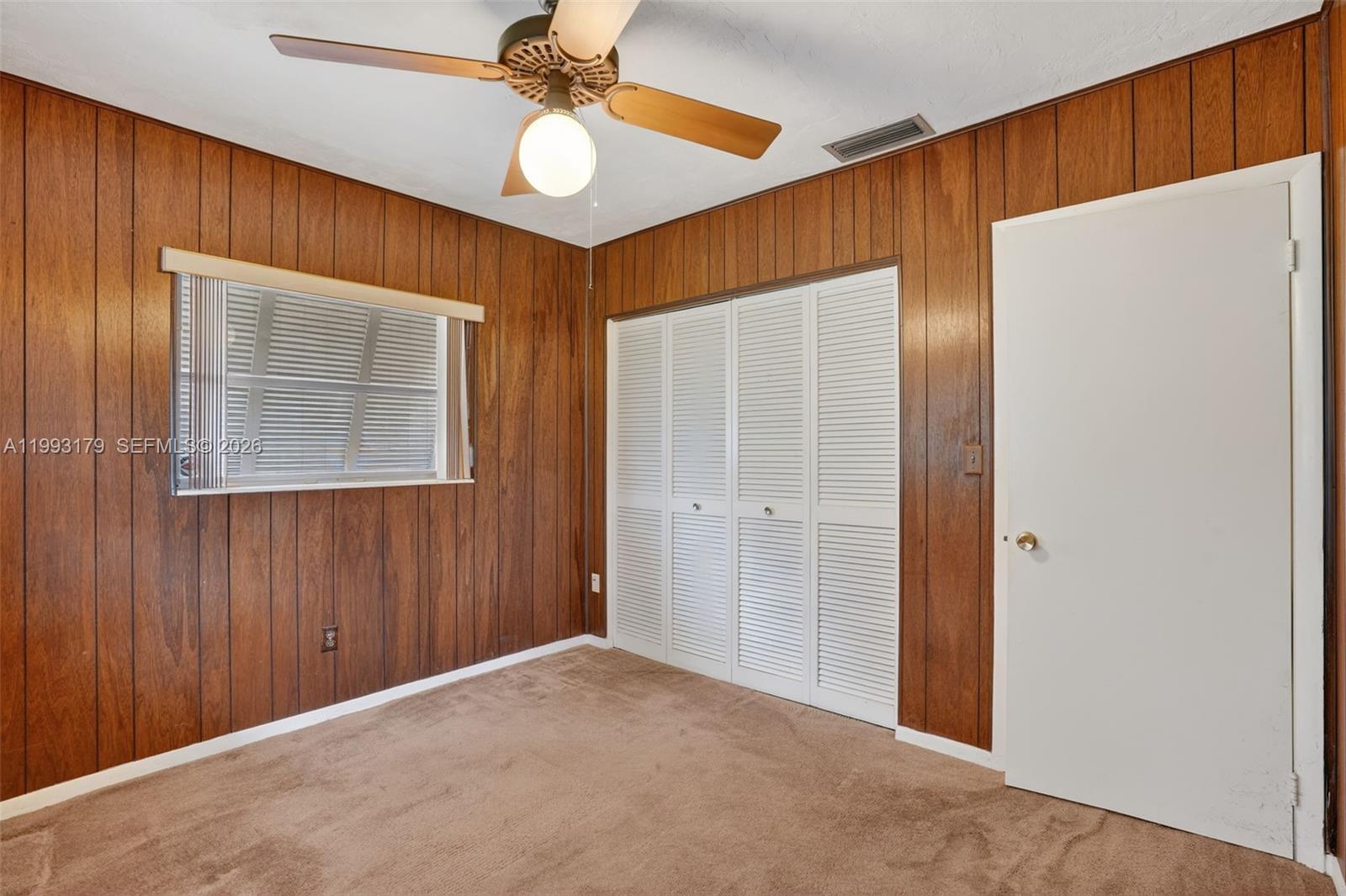 10753 Southwest 118th Street Miami, FL 33176 - Photo 25 of 51 a view of an empty room with a window