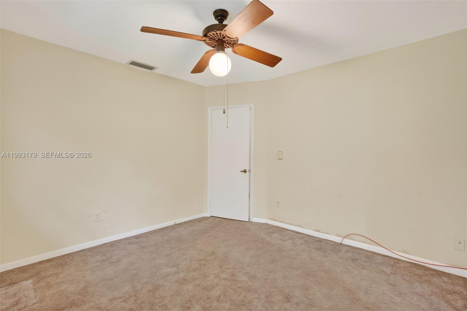 10753 Southwest 118th Street Miami, FL 33176 - Photo 28 of 51 an empty room with a window and a ceiling fan