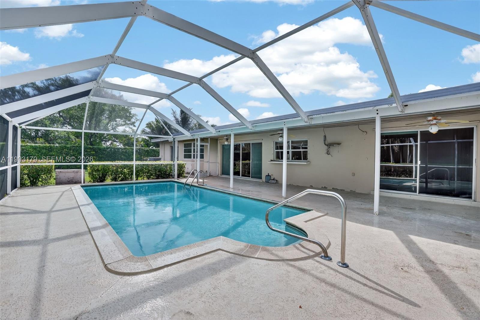 10753 Southwest 118th Street Miami, FL 33176 - Photo 36 of 51 a view of a patio with a table and chairs