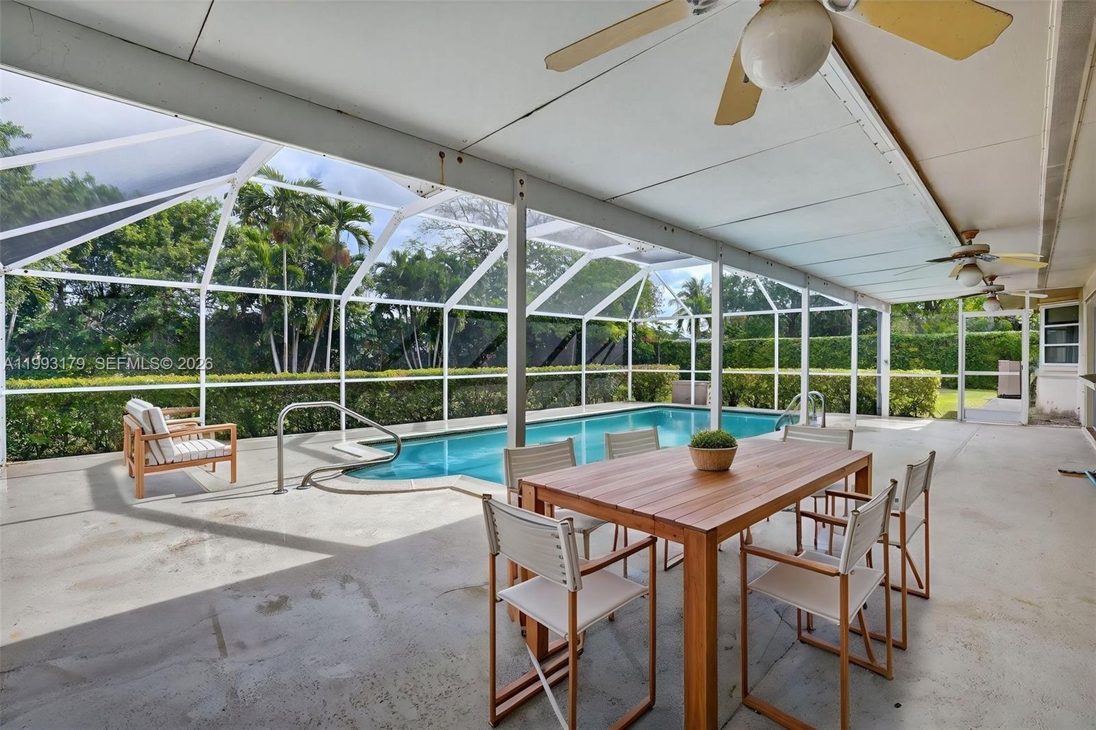 10753 Southwest 118th Street Miami, FL 33176 - Photo 39 of 51 a view of a patio with a yard