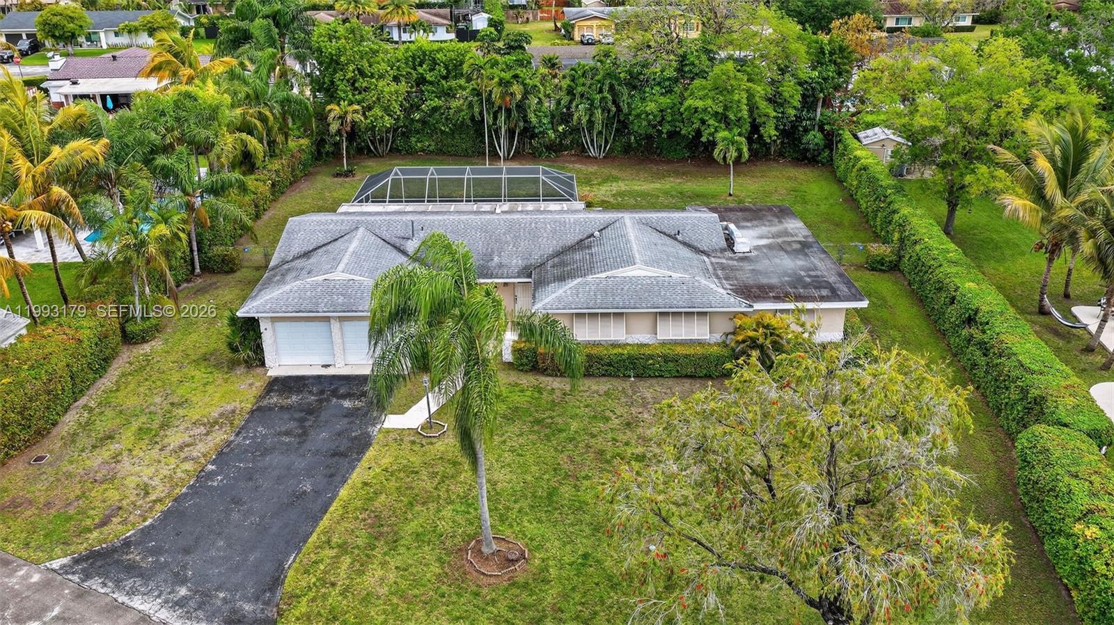 10753 Southwest 118th Street Miami, FL 33176 - Photo 45 of 51 a view of a house with a yard