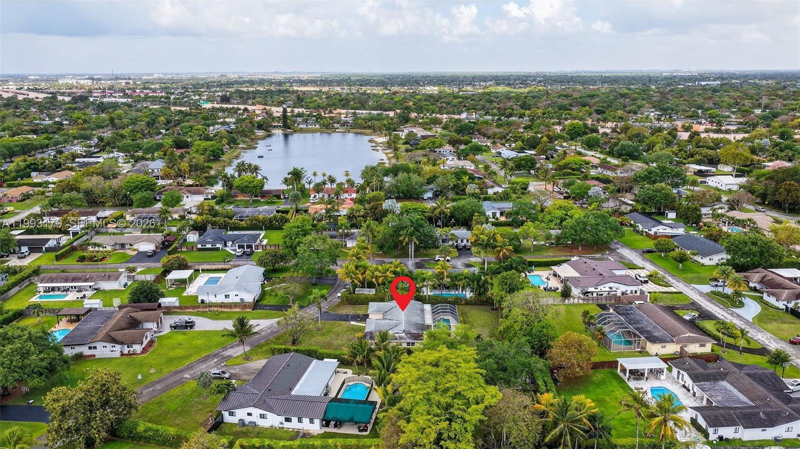 10753 Southwest 118th Street Miami, FL 33176 - Photo 47 of 51 an aerial view of residential houses with outdoor space and trees