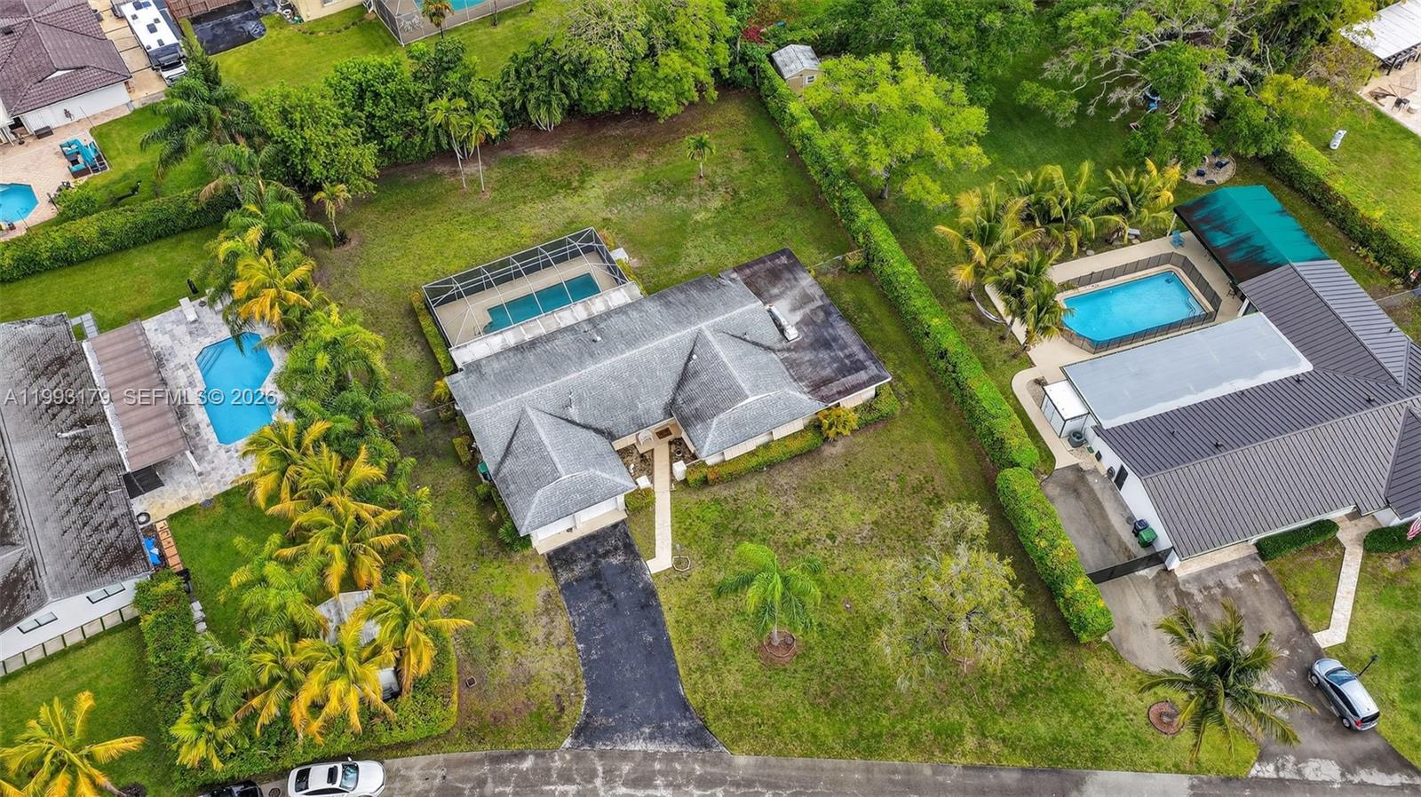 10753 Southwest 118th Street Miami, FL 33176 - Photo 50 of 51 an aerial view of a house with a garden and swimming pool