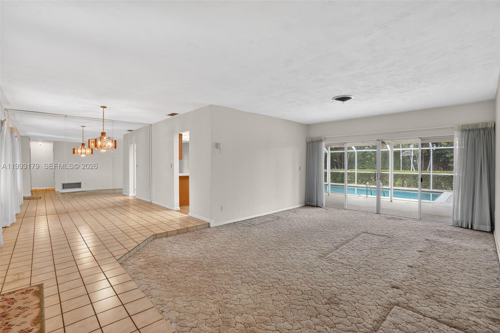 10753 Southwest 118th Street Miami, FL 33176 - Photo 5 of 51 a spacious bedroom with a large bed and a large window