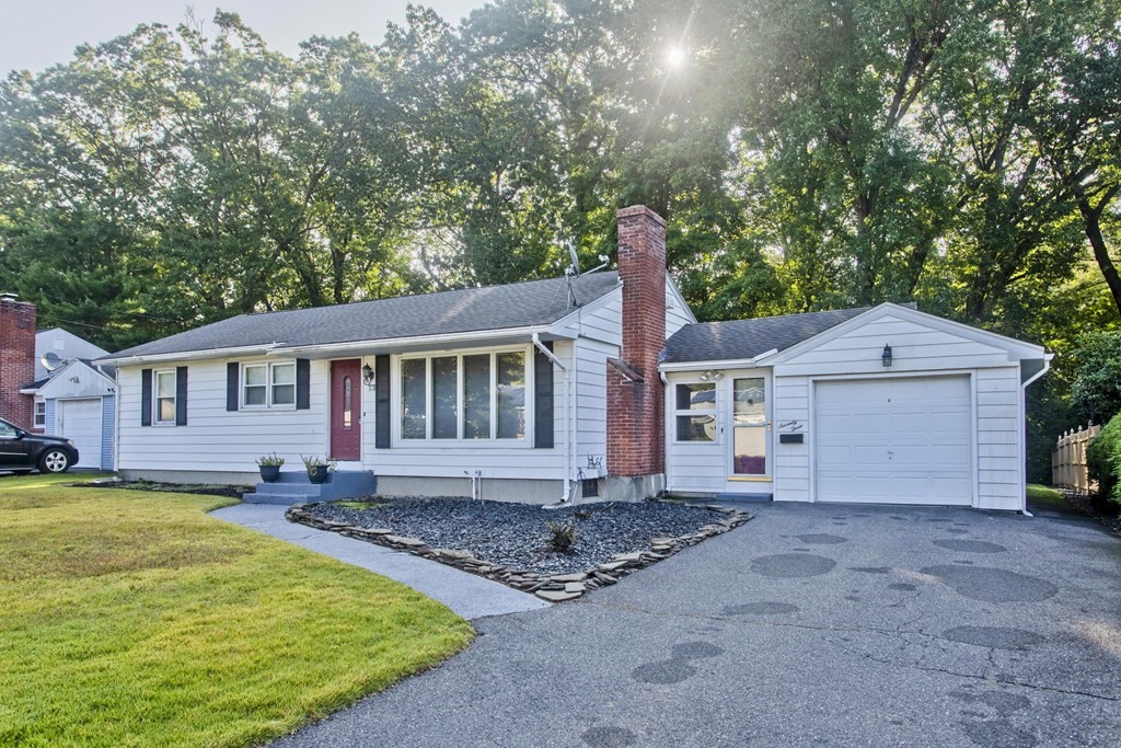 73 Bremen Street Springfield, MA 01108 - Photo 1 of 42 a front view of a house with a yard