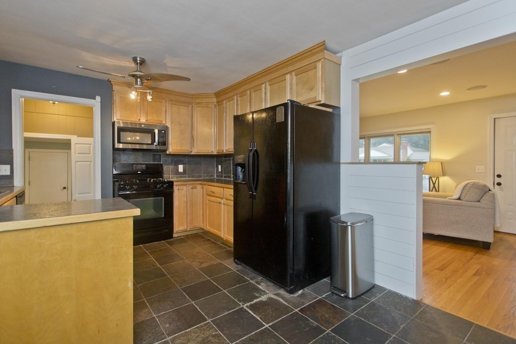 73 Bremen Street Springfield, MA 01108 - Photo 18 of 42 a kitchen with stainless steel appliances a refrigerator and a stove