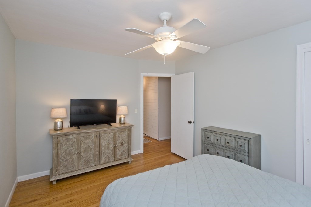 73 Bremen Street Springfield, MA 01108 - Photo 20 of 42 a bedroom with a bed and a flat screen tv