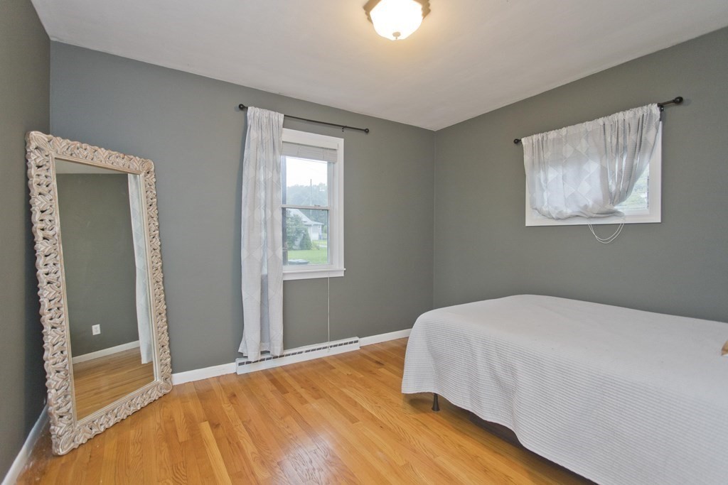 73 Bremen Street Springfield, MA 01108 - Photo 21 of 42 a bedroom with a bed and a window