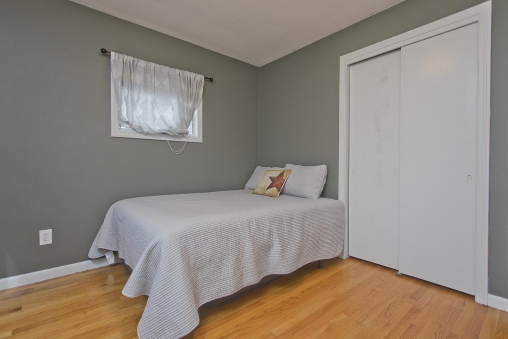 73 Bremen Street Springfield, MA 01108 - Photo 23 of 42 a bedroom with a bed and hallway