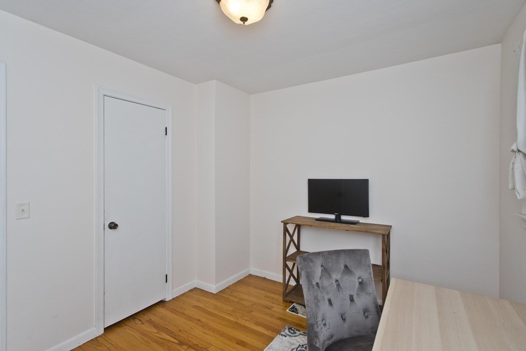 73 Bremen Street Springfield, MA 01108 - Photo 25 of 42 a view of a livingroom with a flat screen tv
