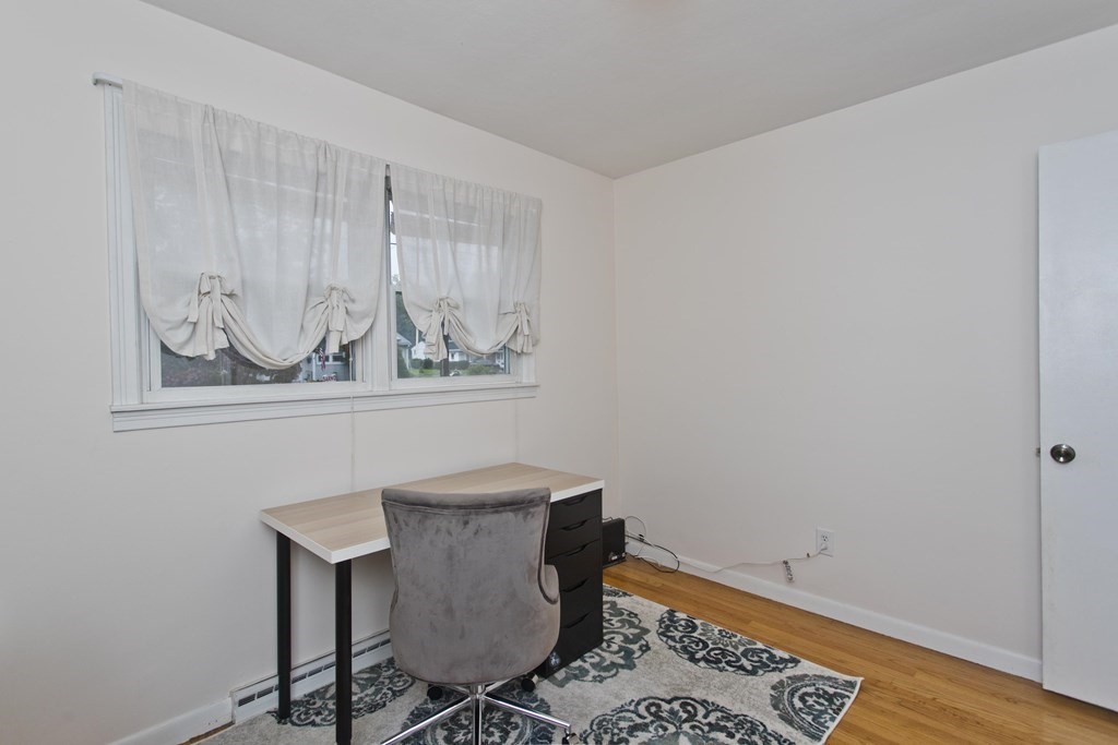 73 Bremen Street Springfield, MA 01108 - Photo 26 of 42 a view of a room that has a table and chair