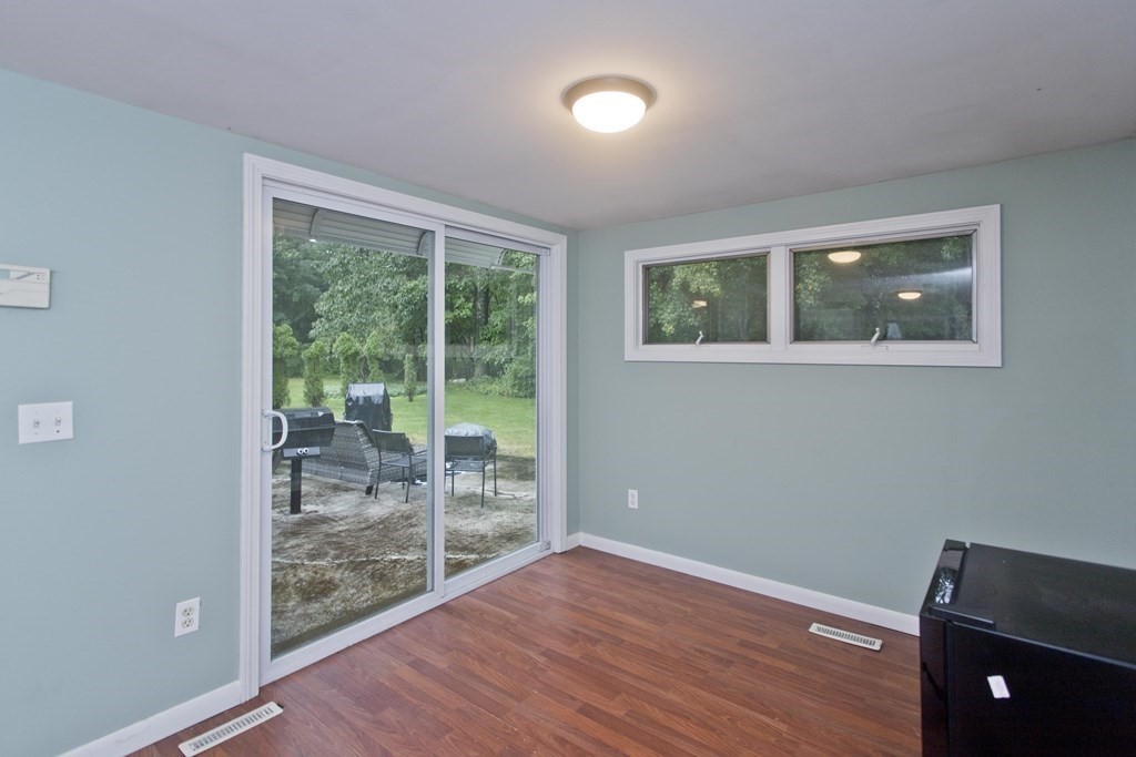73 Bremen Street Springfield, MA 01108 - Photo 30 of 42 a view of an empty room with wooden floor and a window