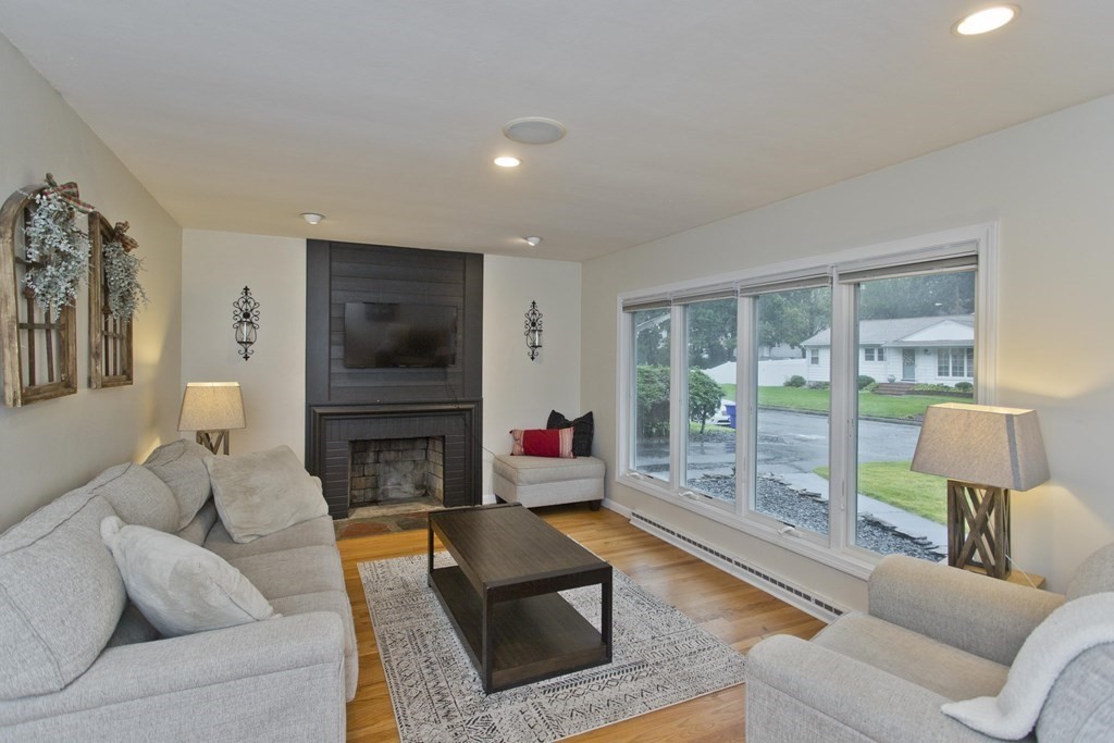 73 Bremen Street Springfield, MA 01108 - Photo 3 of 42 a living room with furniture and a fireplace