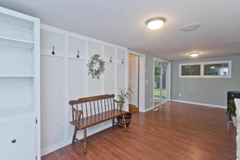 73 Bremen Street Springfield, MA 01108 - Photo 31 of 42 a view of an empty room with wooden floor and a window