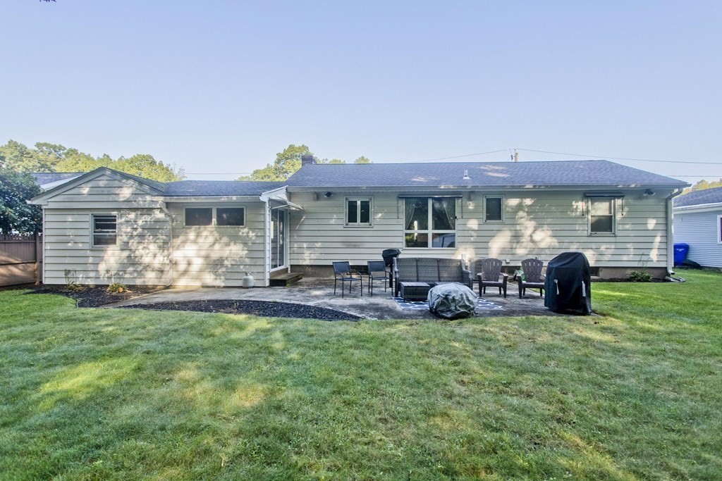 73 Bremen Street Springfield, MA 01108 - Photo 39 of 42 a view of a house with a backyard and a patio