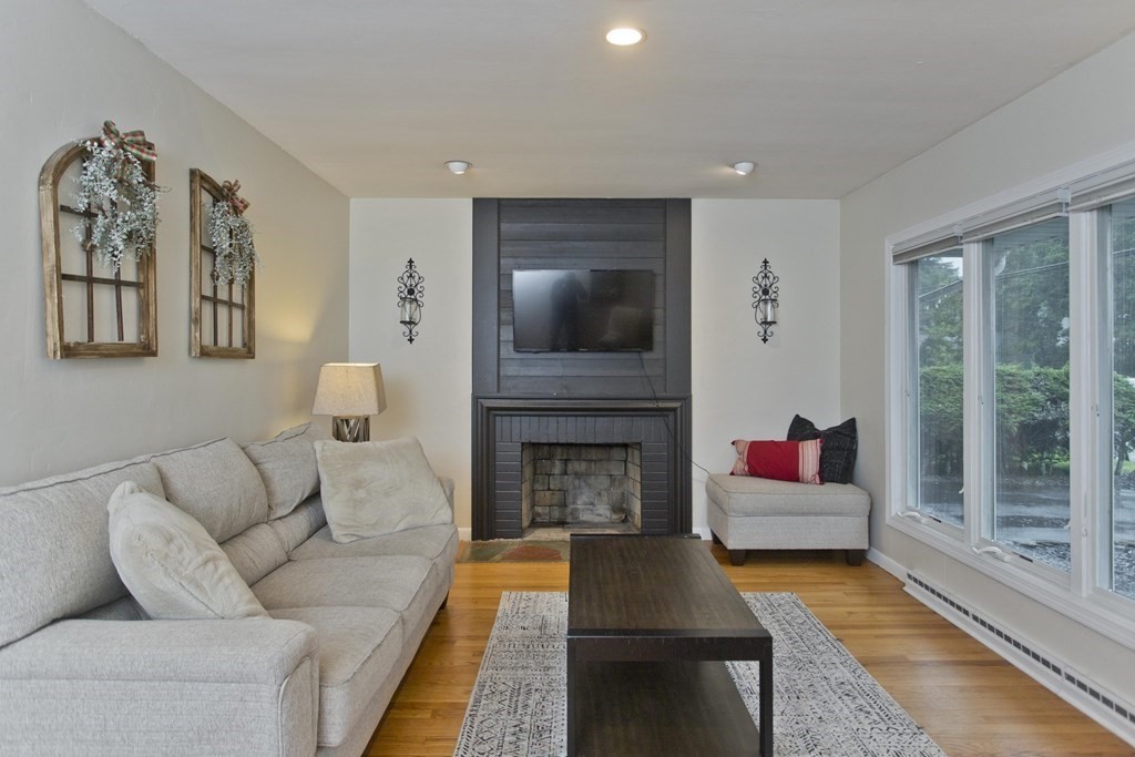 73 Bremen Street Springfield, MA 01108 - Photo 4 of 42 a living room with furniture and a fireplace