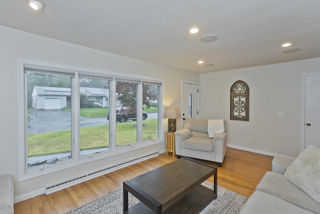 73 Bremen Street Springfield, MA 01108 - Photo 7 of 42 a living room with furniture and a window
