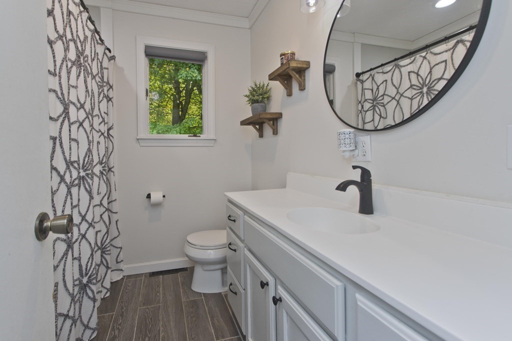 73 Bremen Street Springfield, MA 01108 - Photo 9 of 42 a bathroom with a toilet and a sink