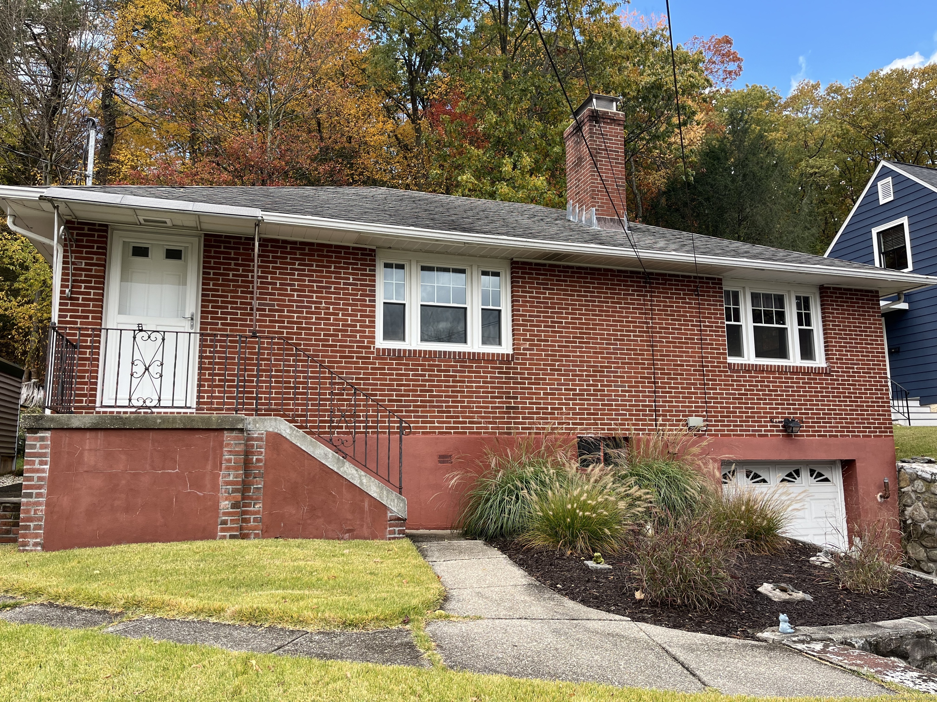 213 Spring Street Torrington, CT 06790 - Photo 1 of 25 a view of a house with a yard potted plants and a table