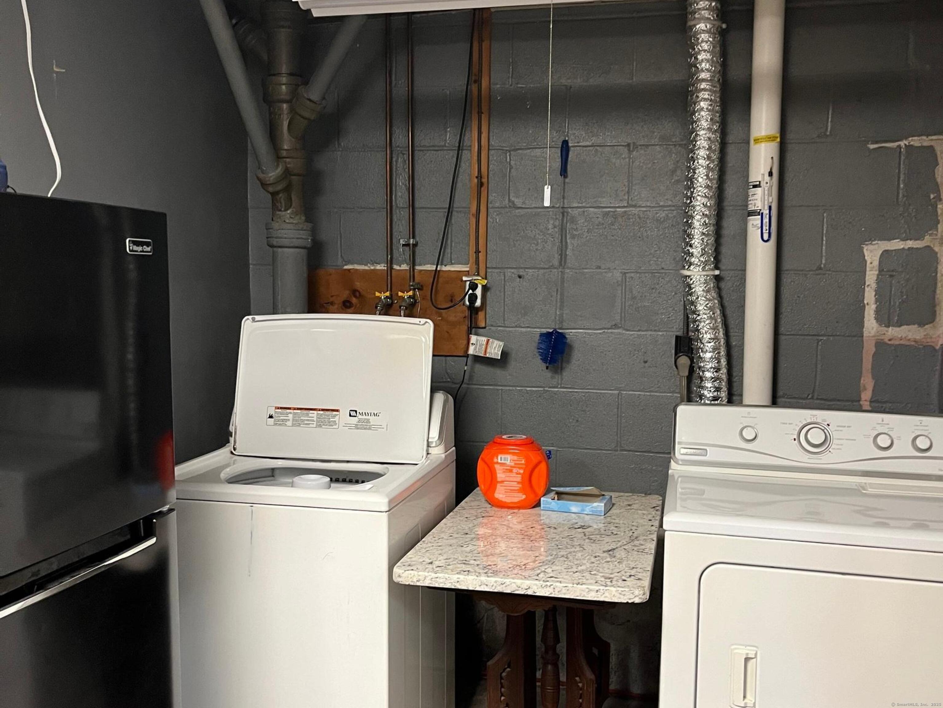 213 Spring Street Torrington, CT 06790 - Photo 18 of 25 a utility room with dryer and washer