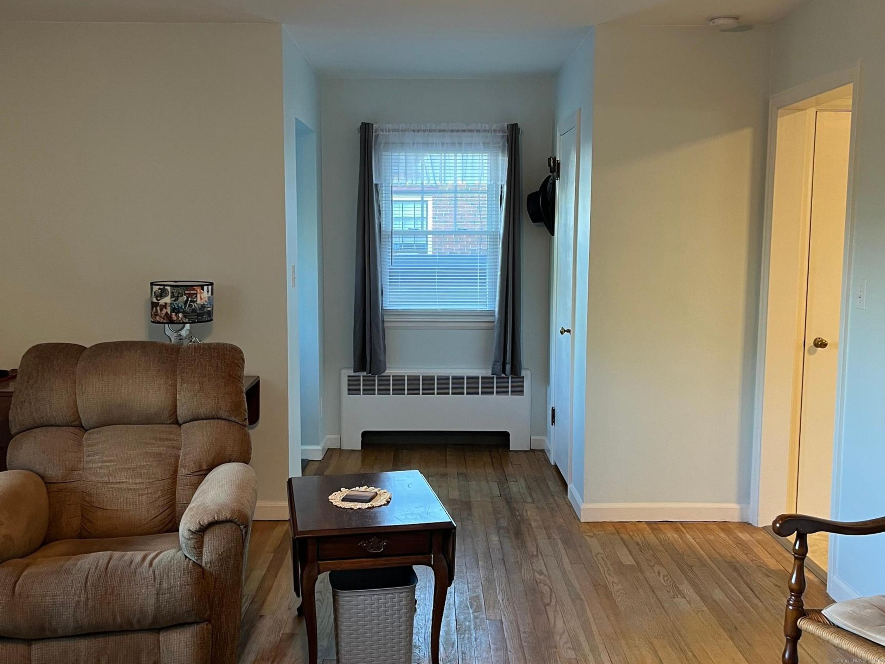 213 Spring Street Torrington, CT 06790 - Photo 4 of 25 a living room with furniture and a window