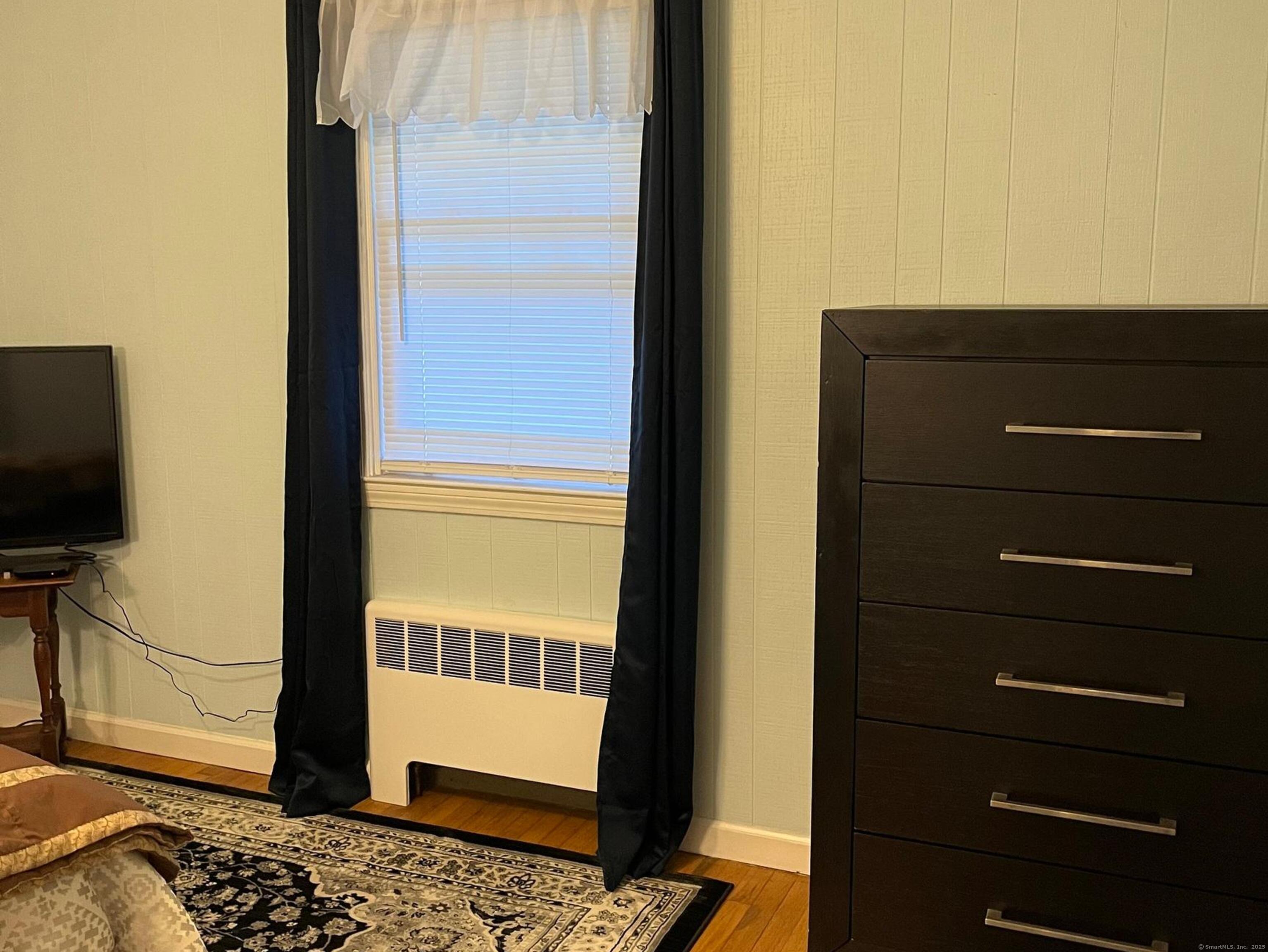 213 Spring Street Torrington, CT 06790 - Photo 5 of 25 a view of a living room with a flat screen tv