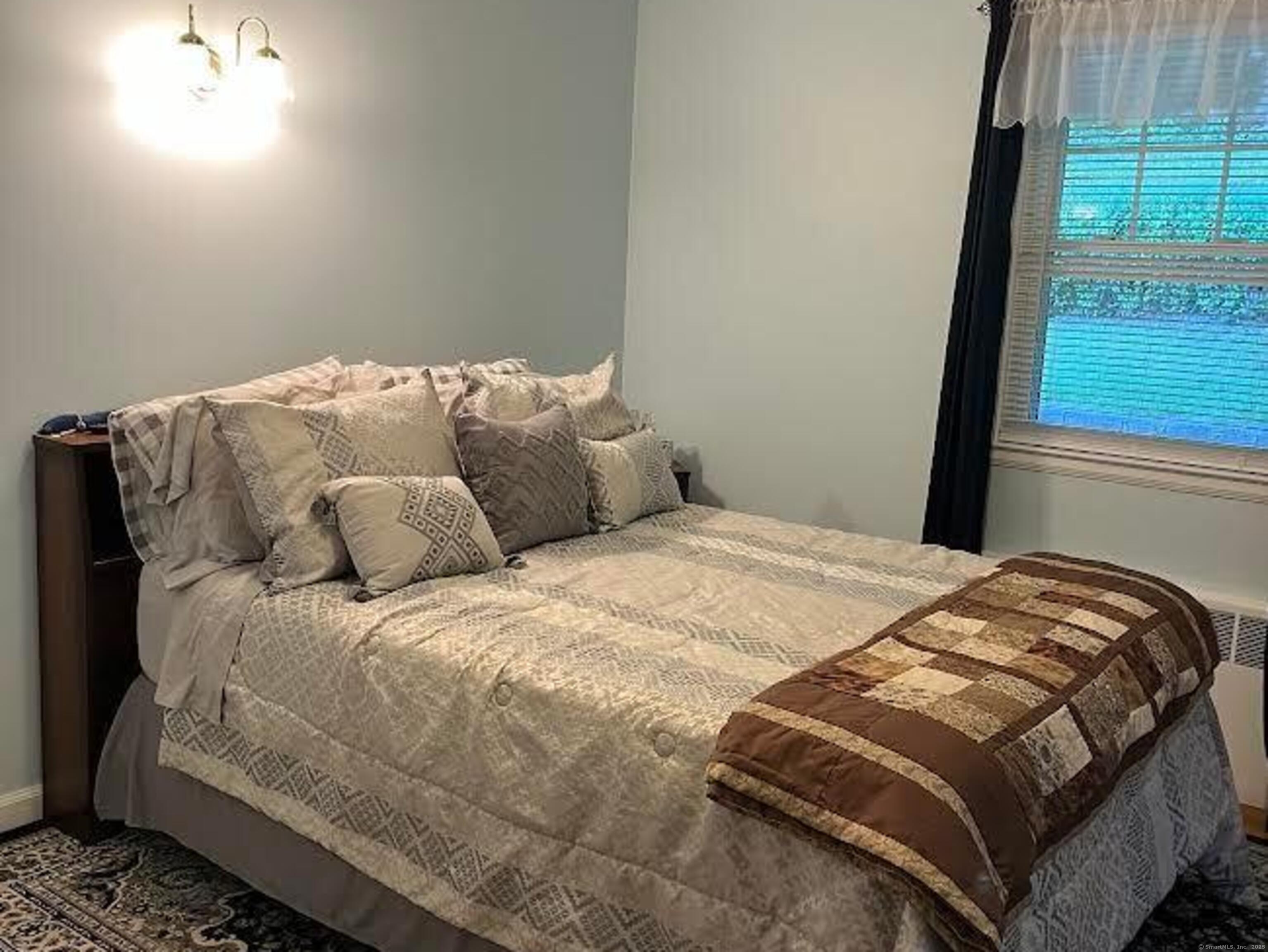 213 Spring Street Torrington, CT 06790 - Photo 8 of 25 a bedroom with a bed and a window