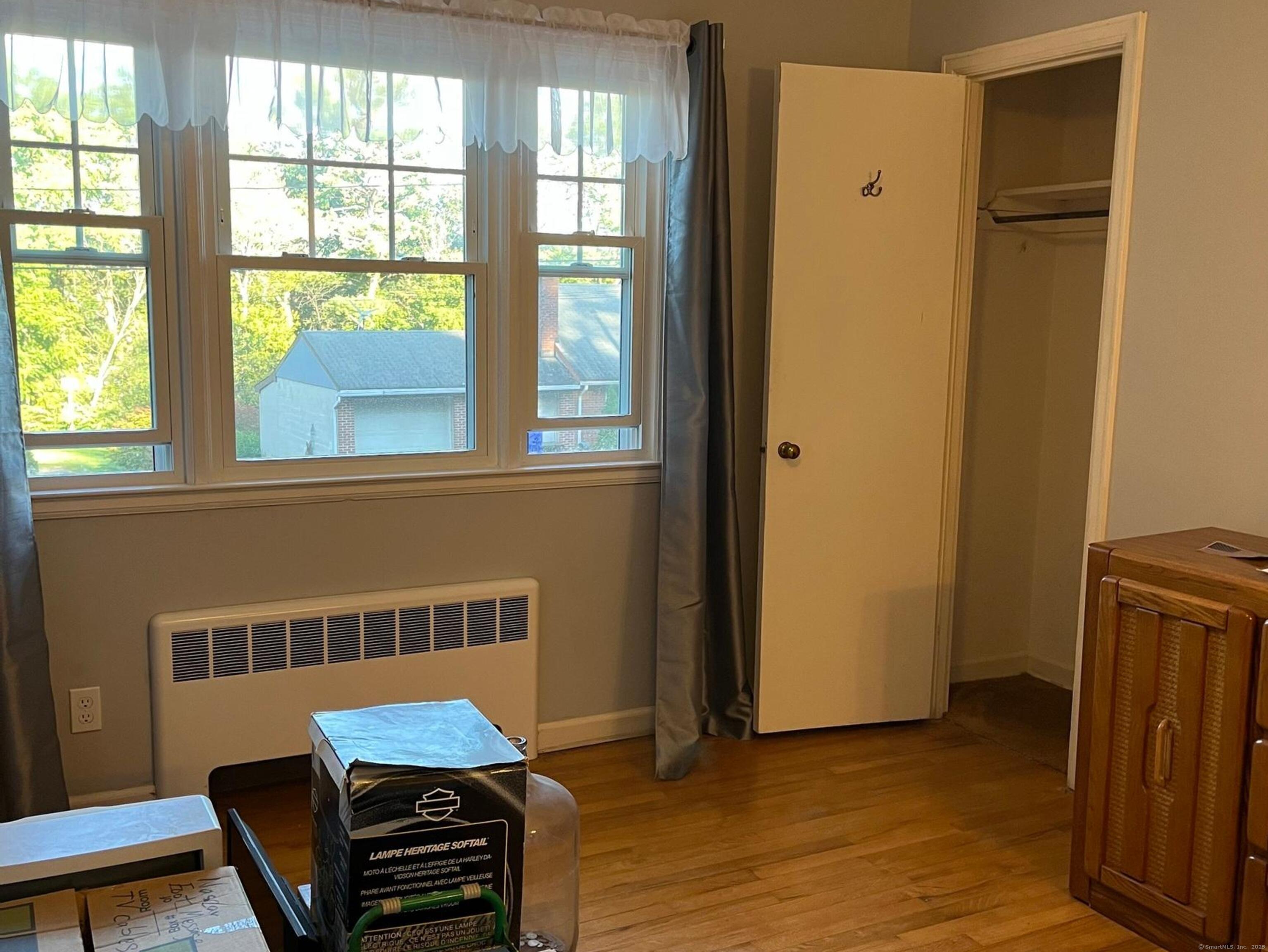 213 Spring Street Torrington, CT 06790 - Photo 10 of 25 a view of a livingroom with furniture and a window