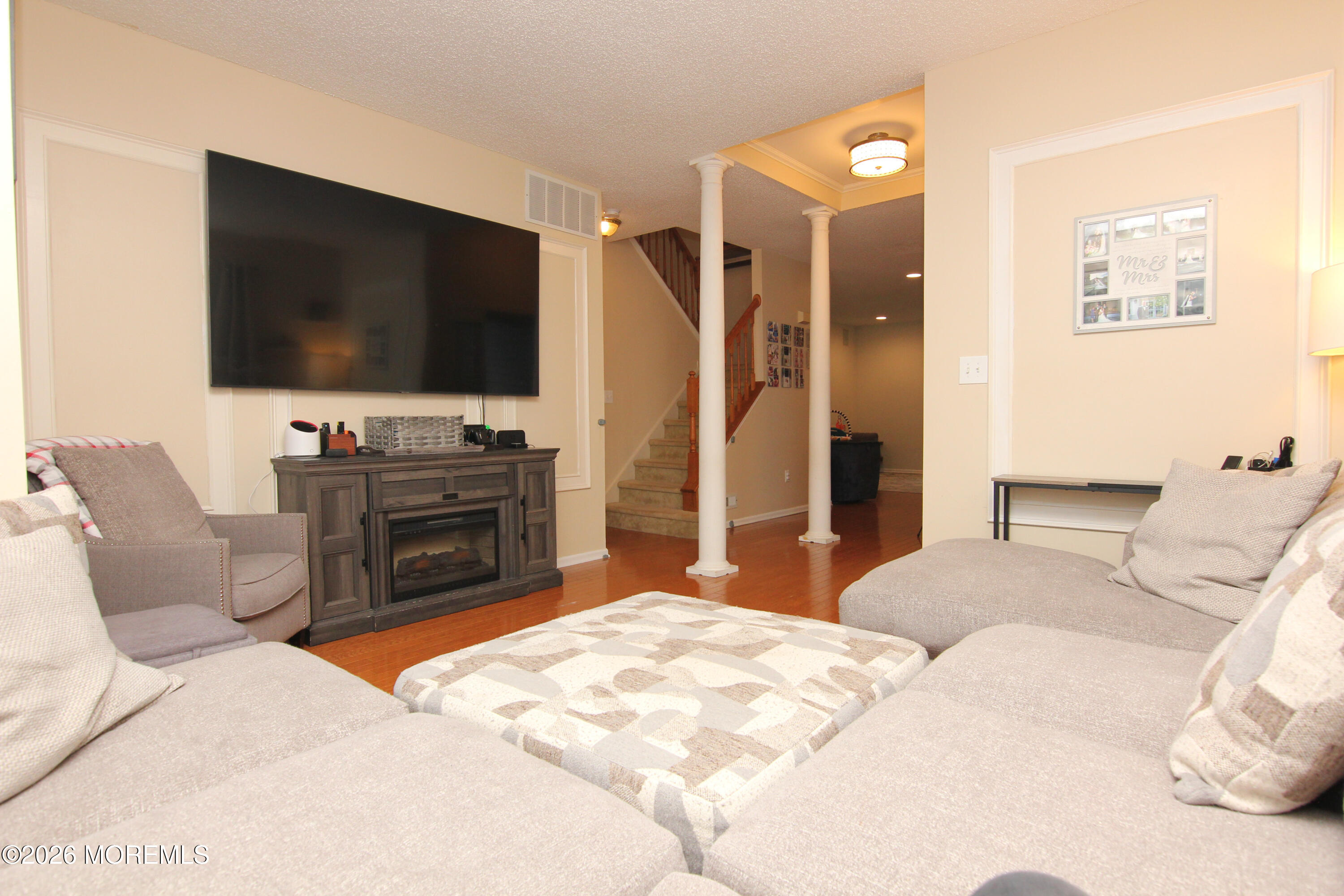 33 Austin Street Tinton Falls, NJ 07712 - Photo 5 of 46 a bedroom with a bed and a flat screen tv