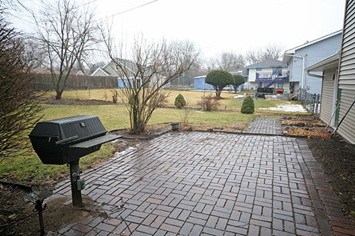 N141 Prince Crossing Road West Chicago, IL 60185 - Photo 11 of 13 a view of yard from terrace with seating space