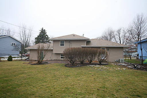 N141 Prince Crossing Road West Chicago, IL 60185 - Photo 13 of 13 a view of a house with backyard and sitting area