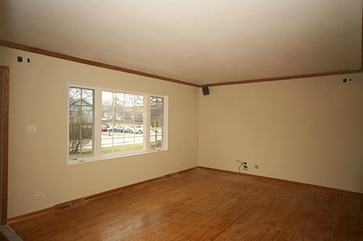 N141 Prince Crossing Road West Chicago, IL 60185 - Photo 3 of 13 a view of a big room with wooden floor and windows