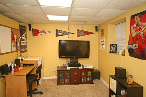 N141 Prince Crossing Road West Chicago, IL 60185 - Photo 10 of 13 a living room with furniture and a flat screen tv