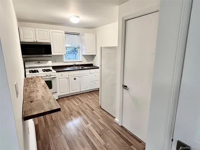 a kitchen with a stove and a microwave