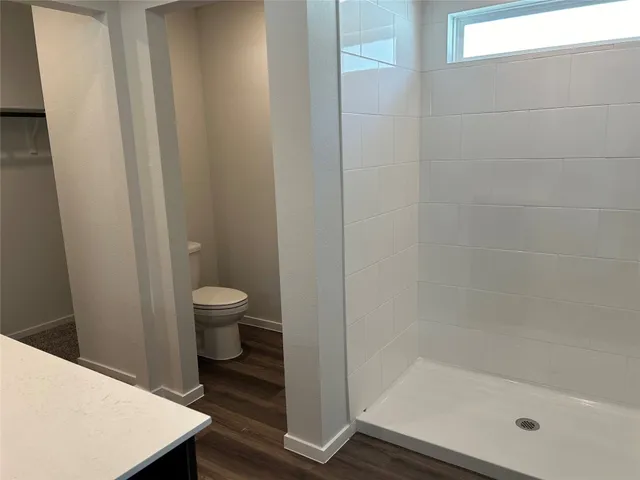 a bathroom with a granite countertop sink